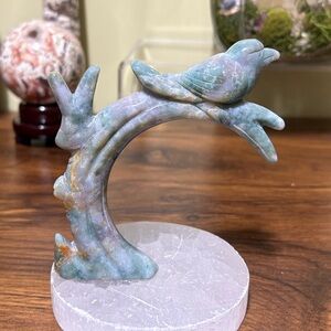 Ocean jasper crystal bird on a branch carving